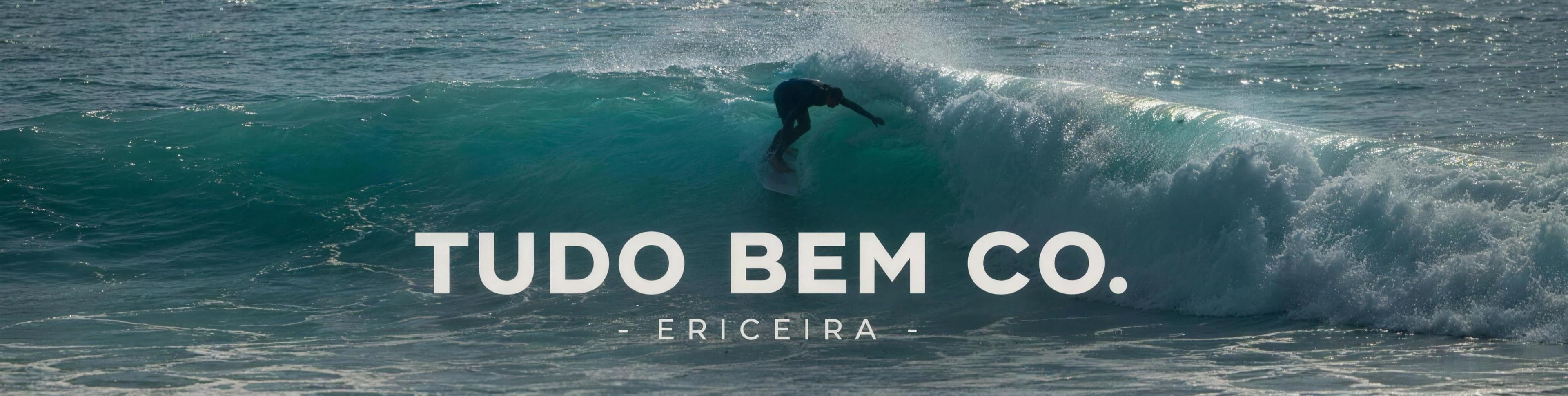 Surfer riding an emerald wave — Tudo Bem Co., Ericeira